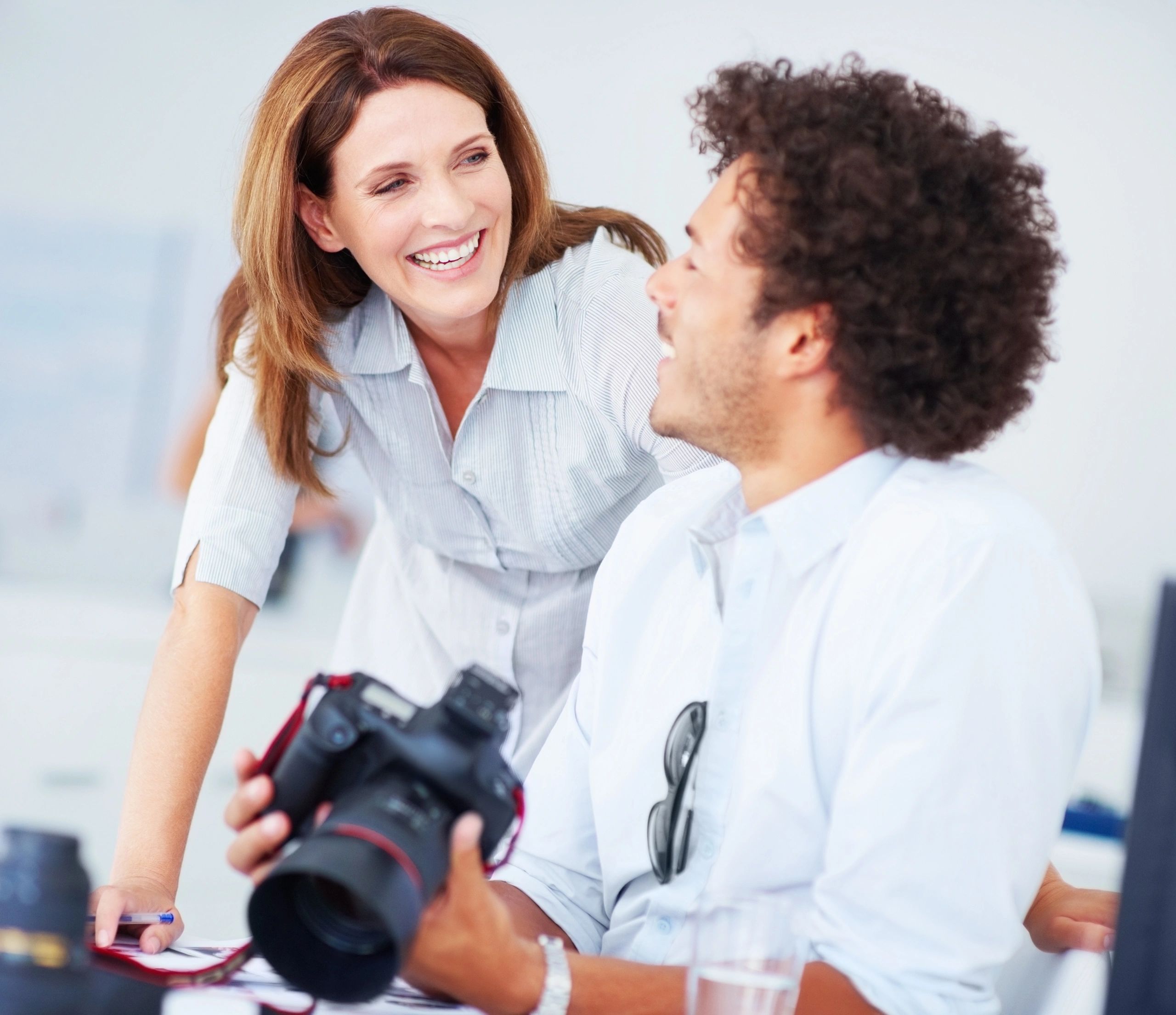 Happy couple with photographer